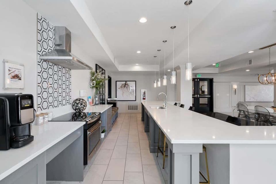 Bright and functional, our kitchen features a coffee maker, induction stove, and a kitchen island for added convenience.