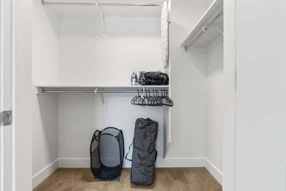 Our walk-in closet is fully equipped with hangers, a flat iron, and a baby stool, ensuring a comfortable stay.