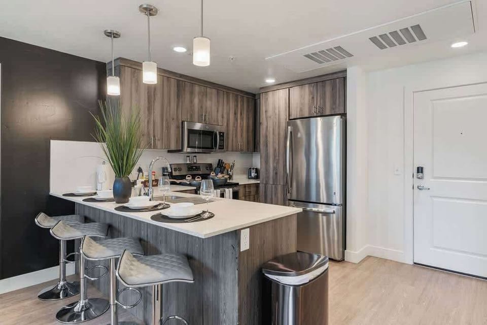 Wake up to fresh coffee in our kitchen, fully stocked with utensils, a dishwasher, and an oven for all your culinary needs.