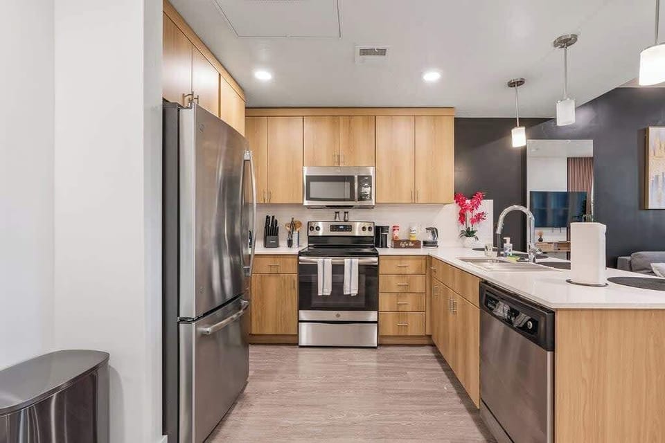 Enjoy family meals in our modern kitchen with an oven, high stools at the bar counter, and a toddler chair.