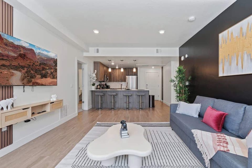 Relaxation meets entertainment in this spacious living room with panoramic views and a smart TV.