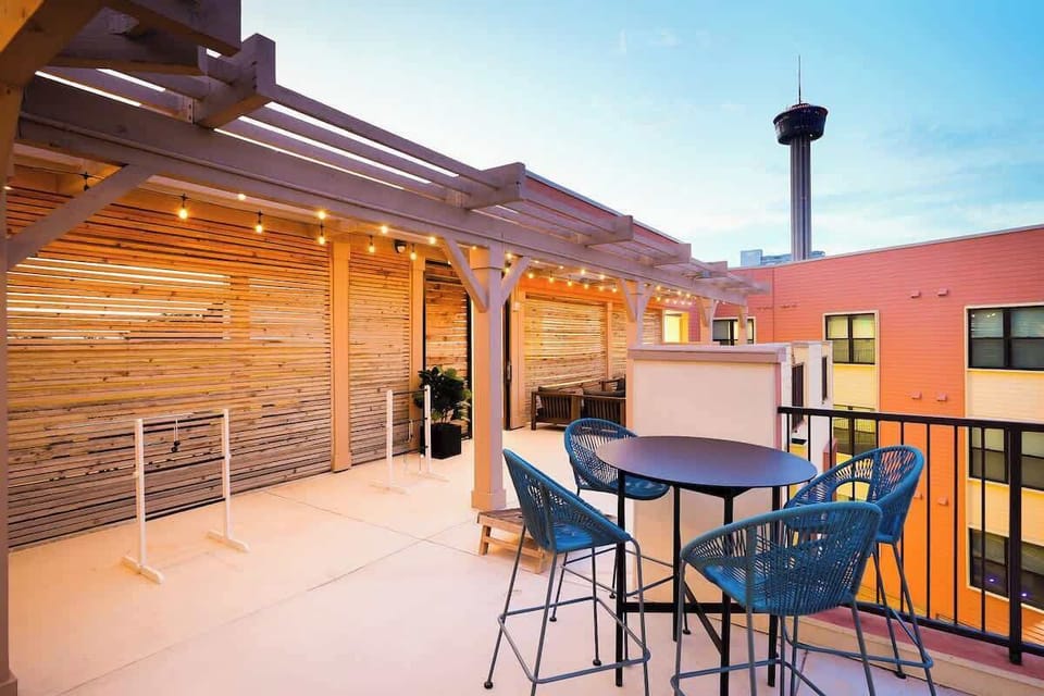 Watch the sun rise and set while relaxing on our roof deck, equipped with high stools, a long table, and comfy couches.