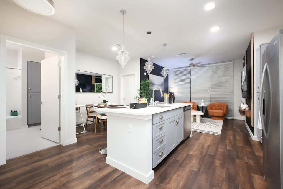 Enjoy the convenience of a modern kitchen with a dishwasher, oven, and a complete set of utensils at your fingertips.