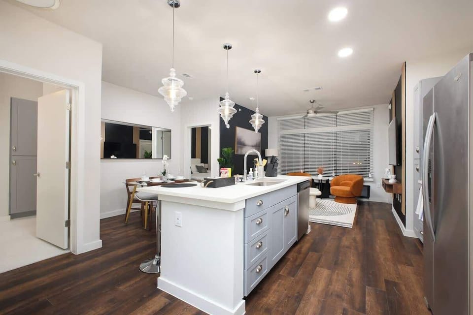 Create culinary magic in our kitchen, where a bar counter and sink meet a full set of amenities and the beauty of mini plants.