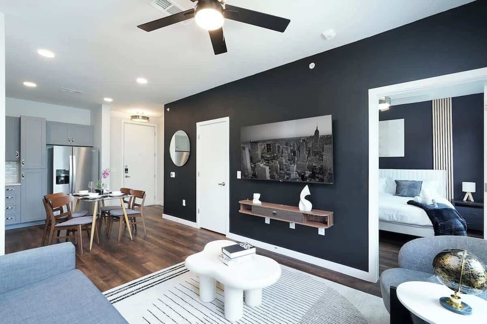 Relax in our living room, with cozy chairs, a comfy sofa, and artistic accents that make it truly unique.