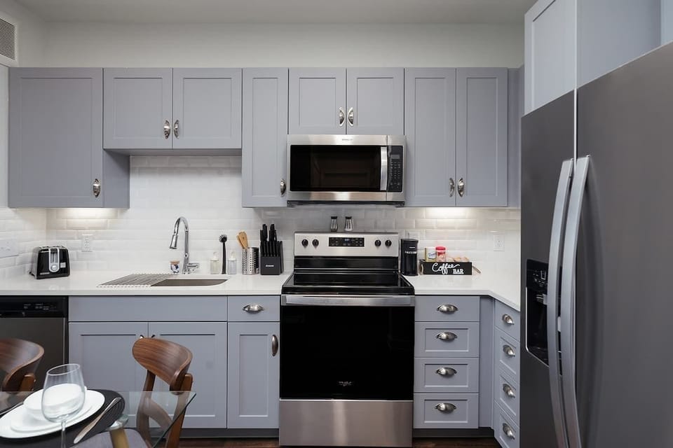 Experience the convenience of a fully-stocked kitchen, coffee maker, and a fresh touch of mini plants.