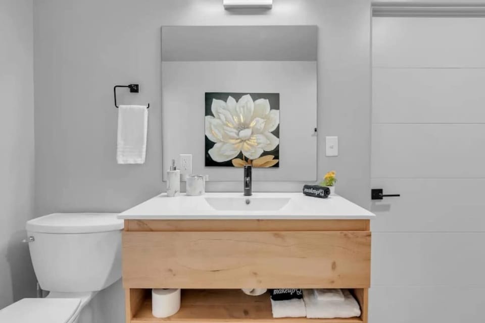 Clean and tidy bathroom with a shower and toilet.