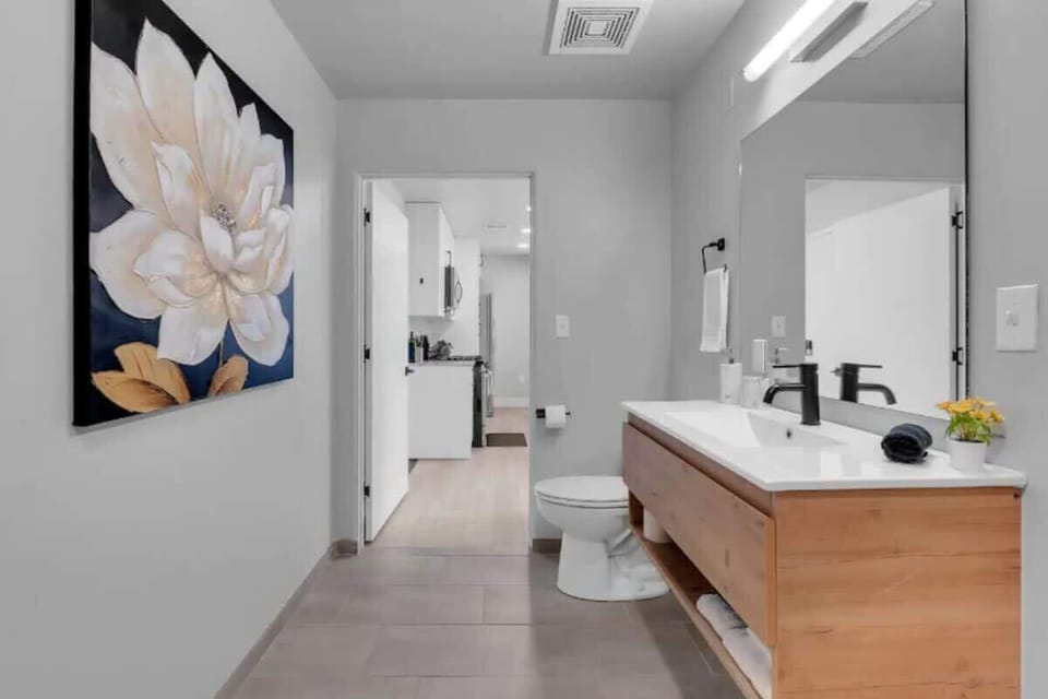 Immaculate bathroom with a shower and toilet.