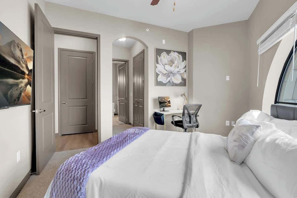 Our comfortable bedroom offers the perfect blend of relaxation and productivity with a TV and a private workstation.