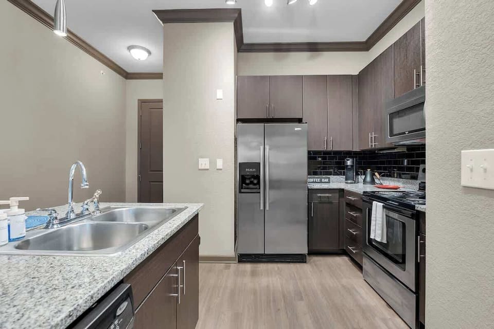 Enjoy meals and conversation at the sleek bar counter in our spacious, modern kitchen.