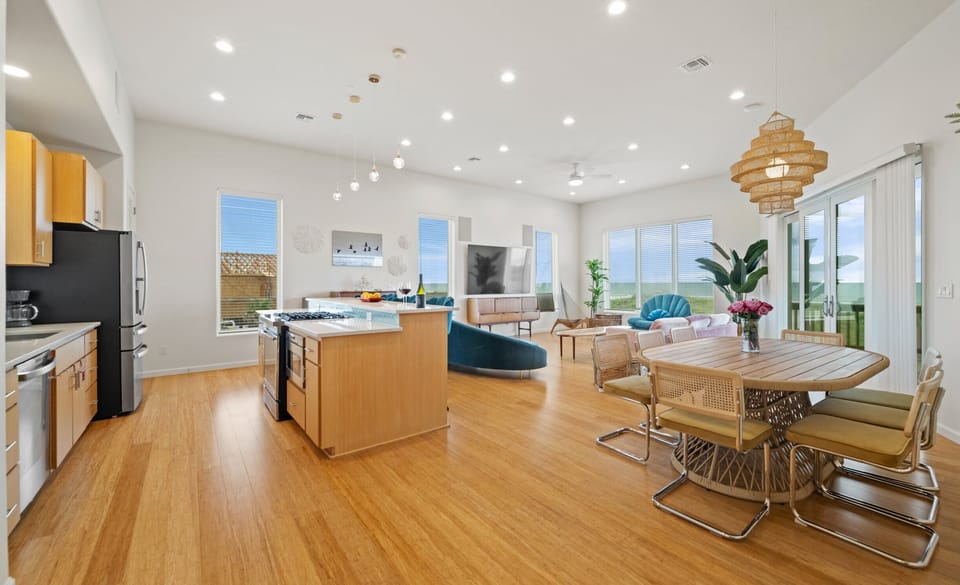 Full Layout — Kitchen Island, Rattan Dining, Living Room & Ocean-View Sliding Doors