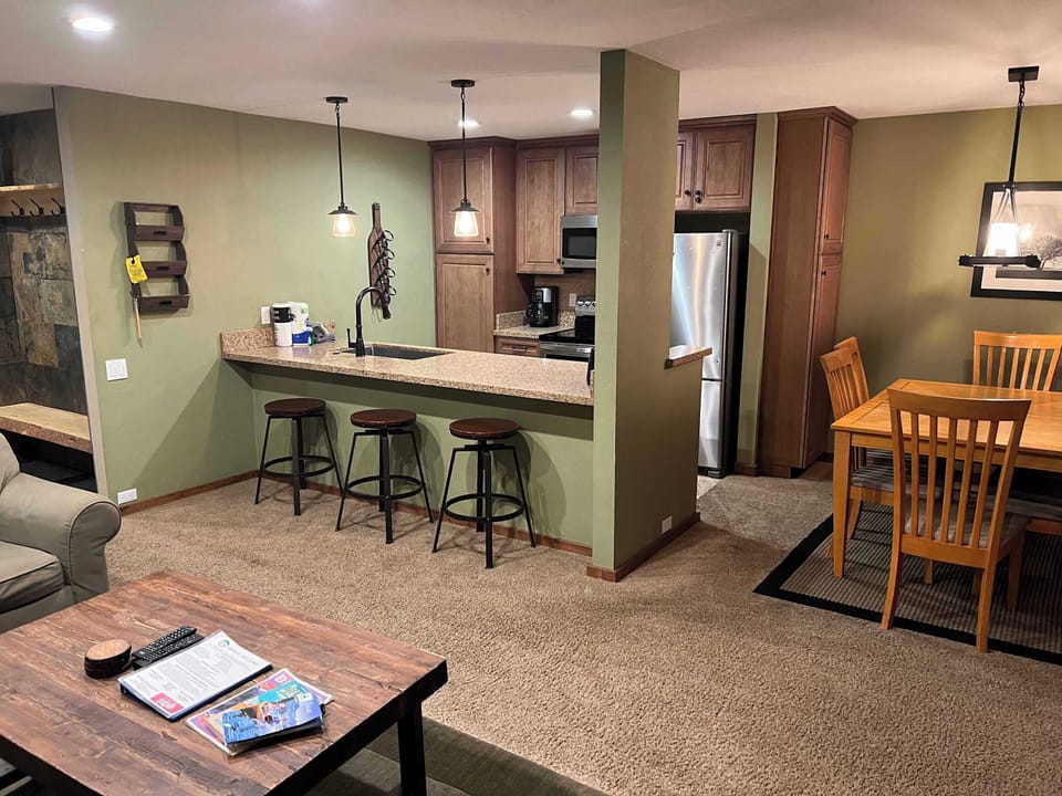 Living room featuring newly remodeled kitchen and appliances
