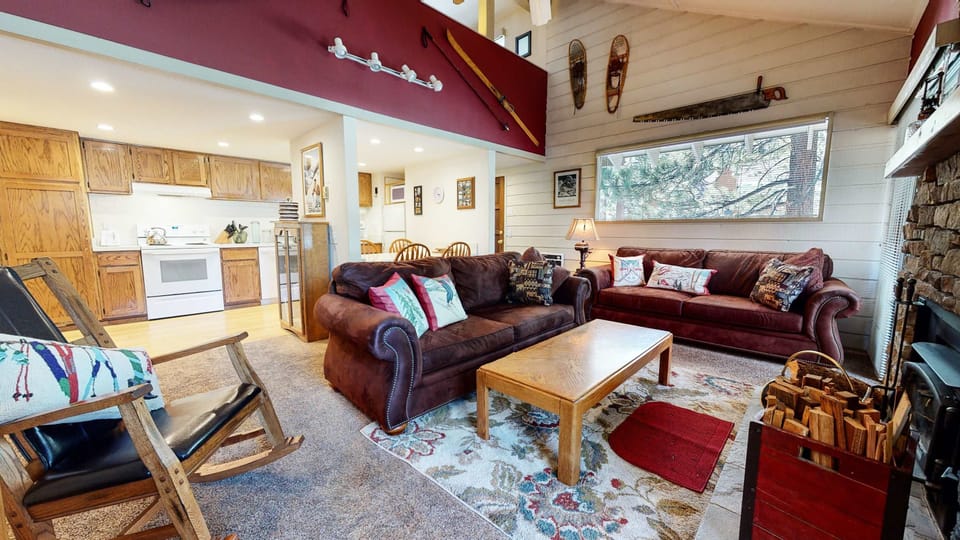 Living room with Smart TV, DVD player, and wood burning fireplace