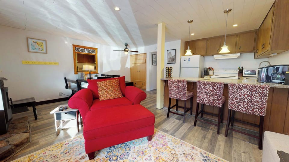 Modern living room with flat screen TV, pellet stove