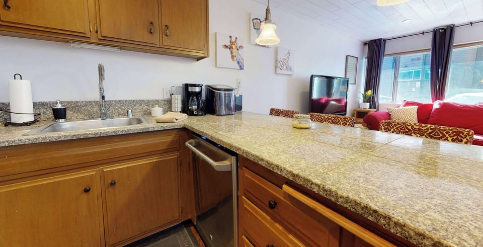 Kitchen with Nespresso, drip coffee pot, slow cooker, blender and more