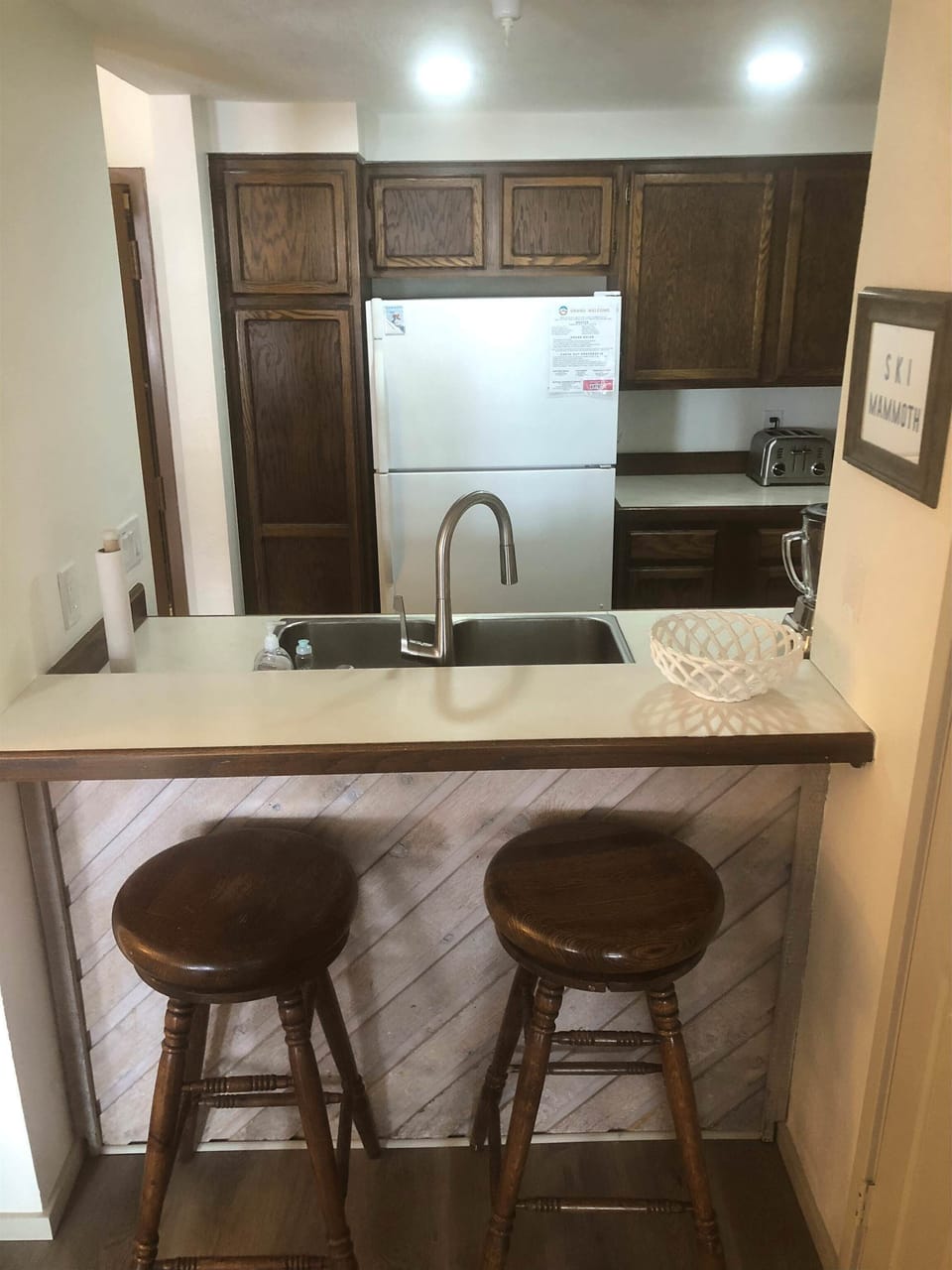 Kitchen w/ drip coffee pot, toaster, pots, pans