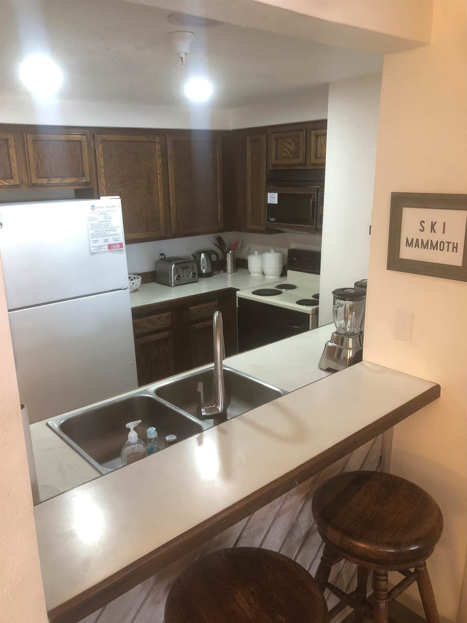 Kitchen w/ drip coffee pot, toaster, pots, pans