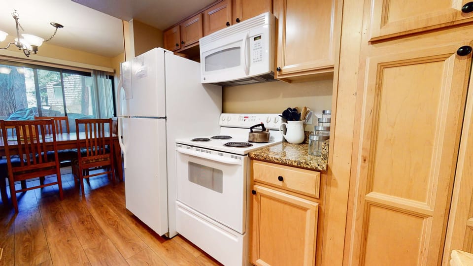 Kitchen with drip coffee maker, blender, tosater, and more