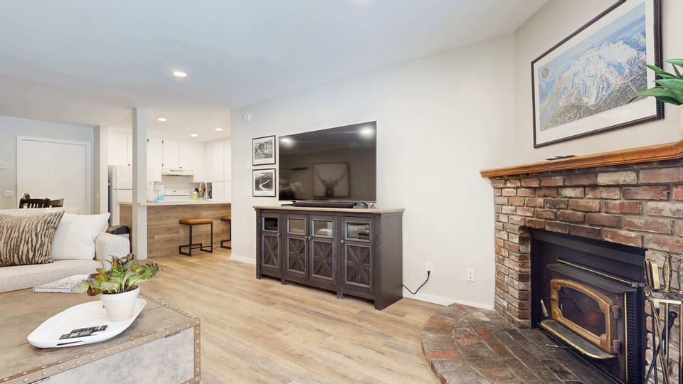 Bright living space with ample seating, Smart TV, and bunk bed nook