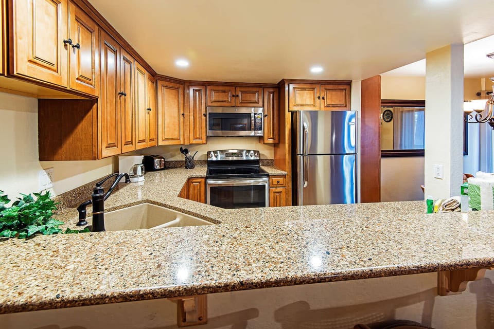 Kitchen w/ toaster, drip coffee pot, blender, slow cooker, and more