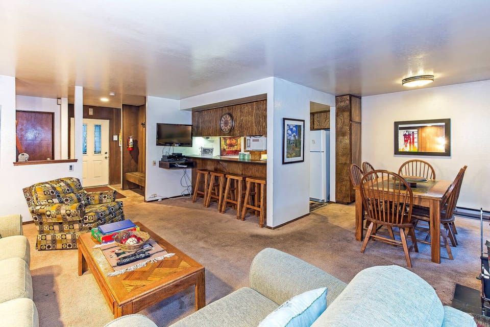 Living room w/ sofa sleeper, wood burning fireplace, TV