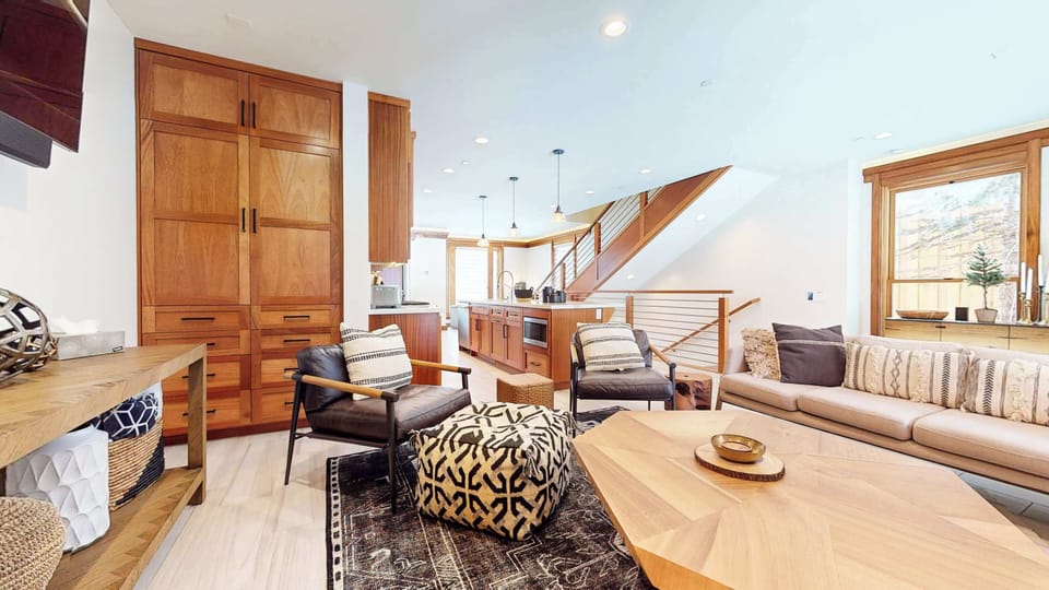 Bright living space with gas fireplace, and Smart TV