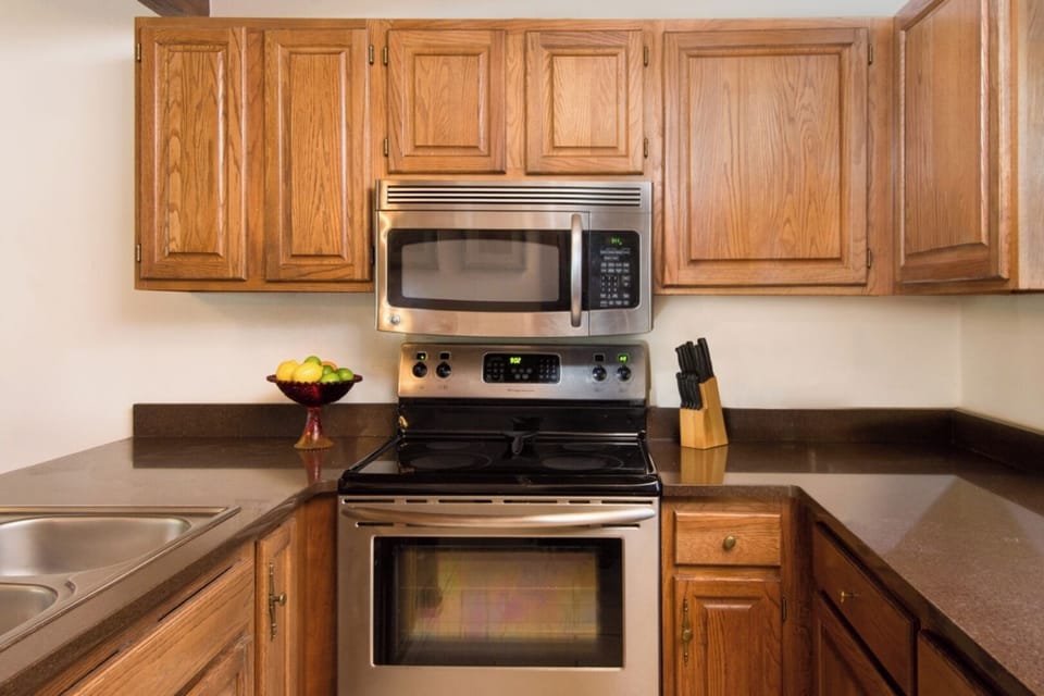 Your fully equipped kitchen awaits with stainless steel appliances, ample counter space, and all the essentials for preparing home-cooked meals during your stay.