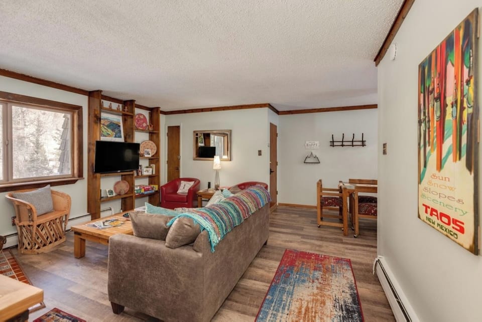 Unwind in your cozy living room with comfy seating, colorful ski-lodge touches, and space to truly relax after a day of adventure.