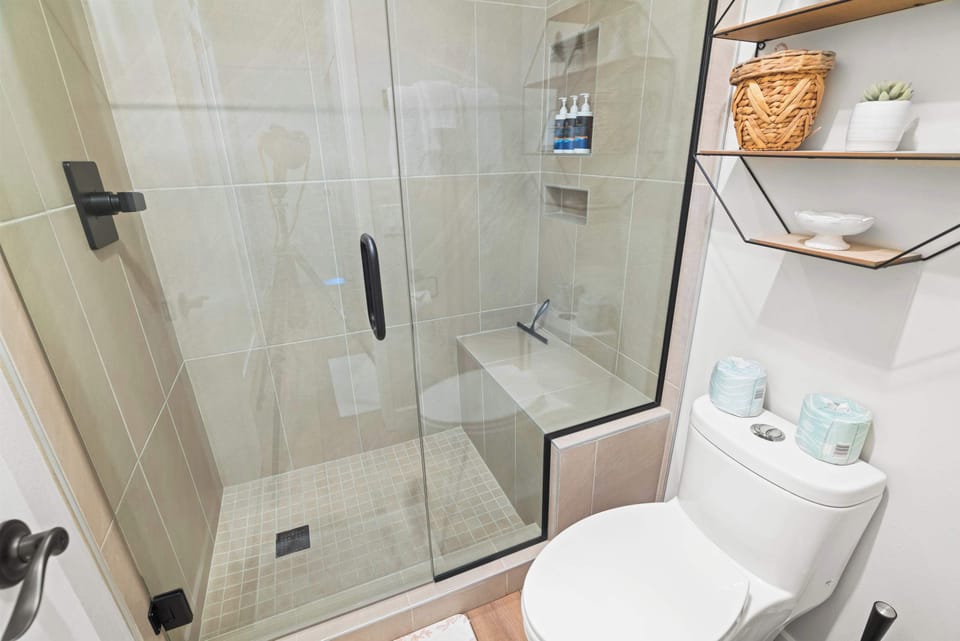 En suite bathroom with sink and showertub combo