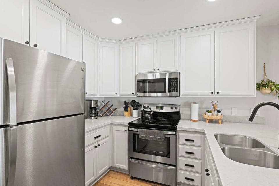 Kitchen with drip coffee pot, slow cooker, blender, toaster, and more