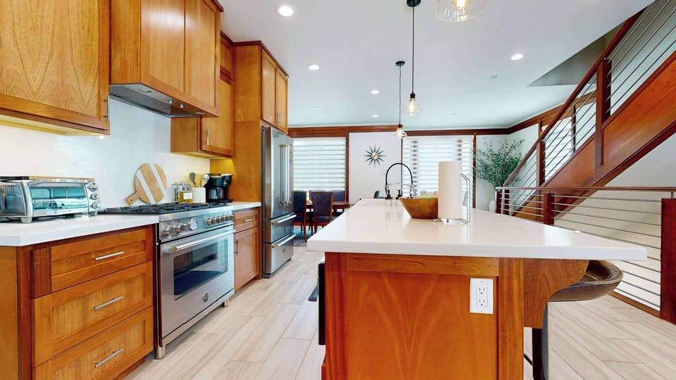 The kitchen is a gourmet’s dream, offering top of the line appliances and sprawling counterspace