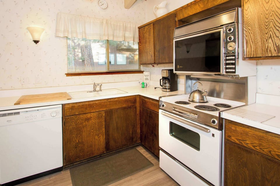 Kitchen with drip coffee pot, dishwasher, blender, slow cooker and more
