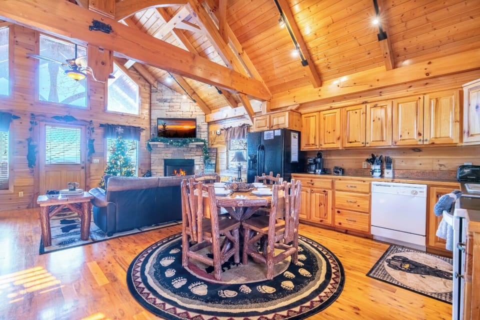 Step into your rustic mountain retreat where warm wood surrounds you, and the open kitchen flows seamlessly into cozy living spaces.