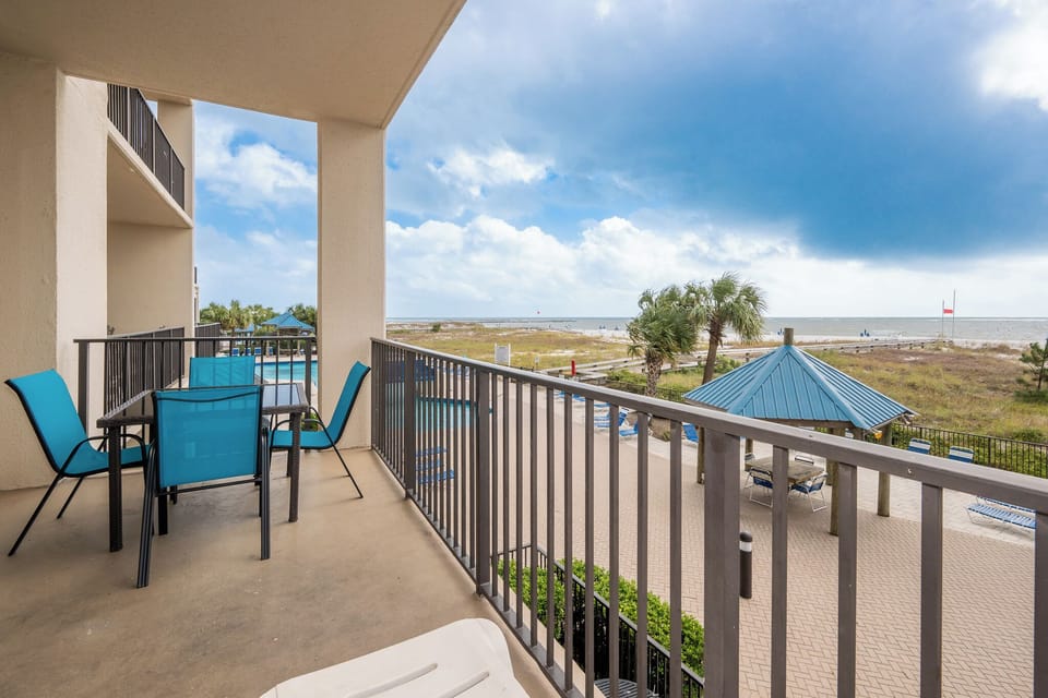 Enjoy meals or drinks at the outdoor dining set while taking in views of the beach and nearby pool area