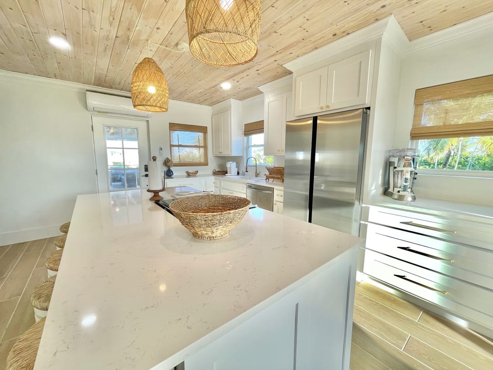 Kitchen with large island w/ pool and ocean views
