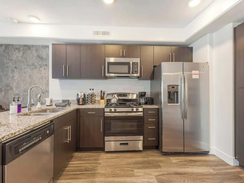 Cook with ease in the modern kitchen featuring stainless steel appliances & ample counter space