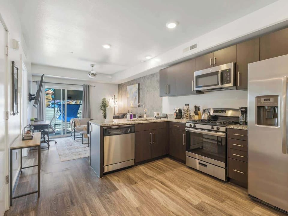 Open-concept layout connecting the kitchen, dining & living area for easy gathering