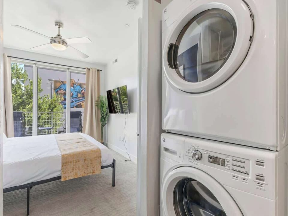 In-unit washer & dryer tucked conveniently beside the bedroom