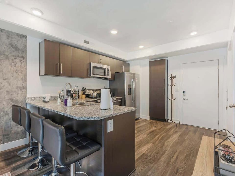 Gather at the kitchen island w/ bar seating, perfect for casual meals or morning coffee