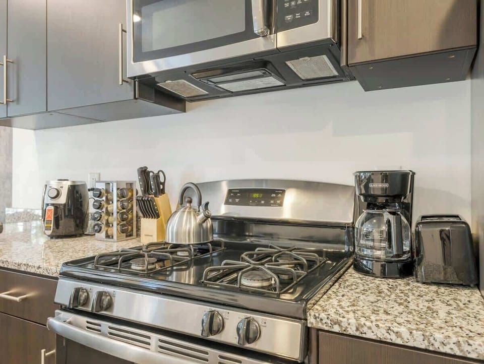 Fully equipped kitchen w/ gas stove, coffee maker & essentials ready for home cooking