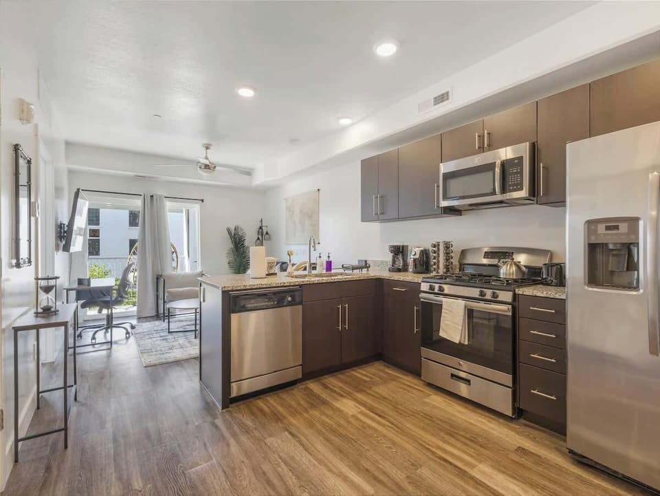 Open layout kitchen flowing into living area for easy gathering & cooking