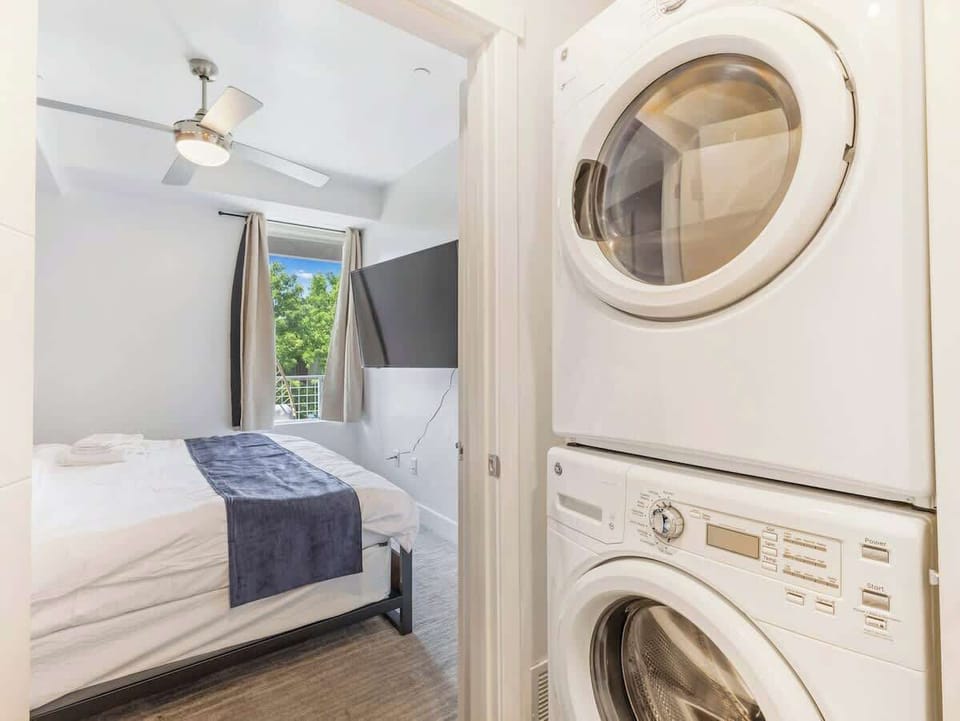 Bedroom view w/ in-unit laundry nearby for added convenience during your stay