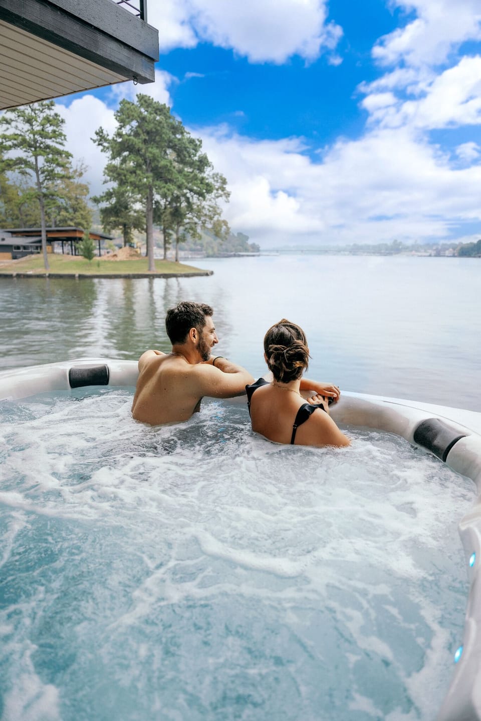 Relax in our hot tub with breathtaking lake views