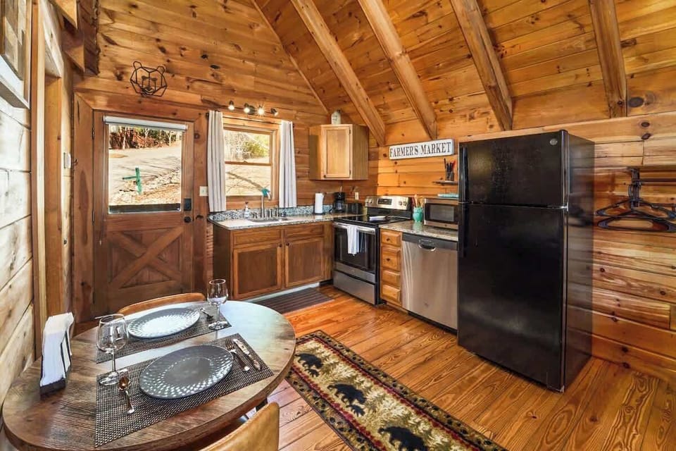 The kitchen features granite countertops, quality appliances and is fully stocked for all of your cooking needs.