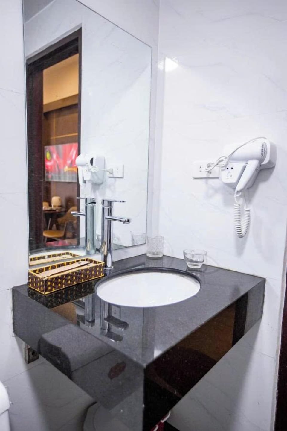 Shower, hair dryer, slippers, towels