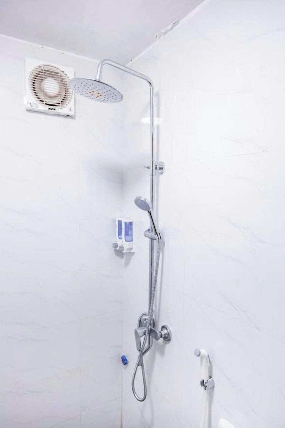 Shower, hair dryer, slippers, towels