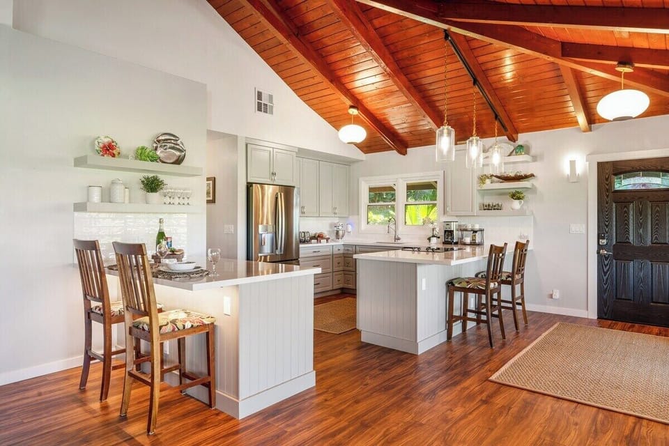Spacious living room complete with stainless steel appliances and clean cabinetry