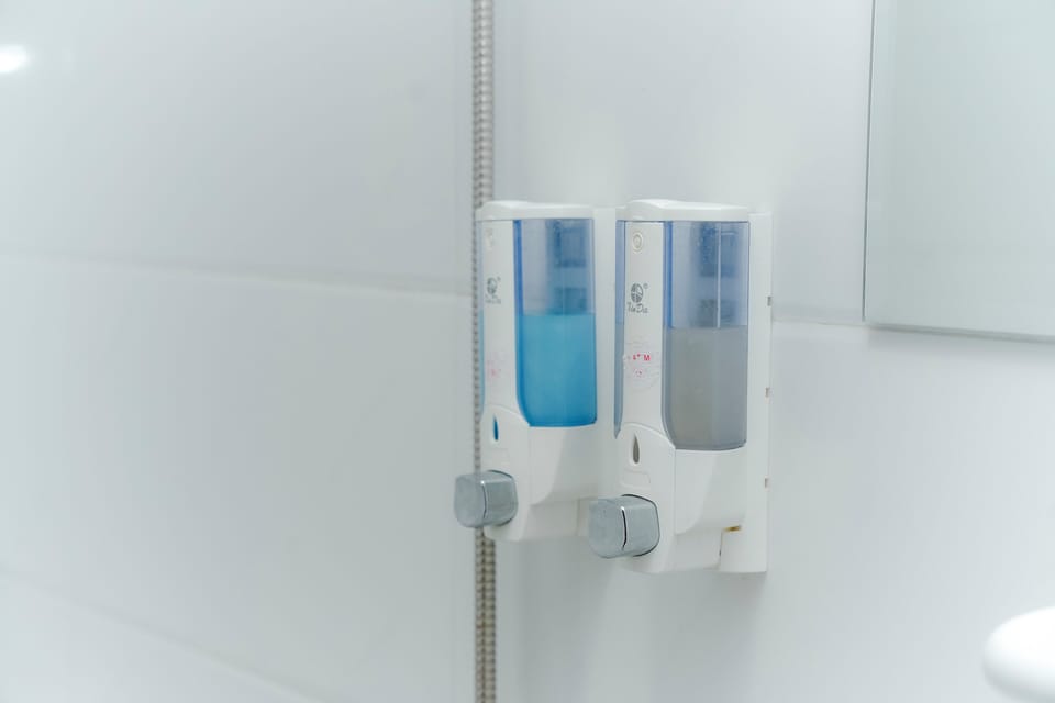 Shower, hair dryer, slippers, towels