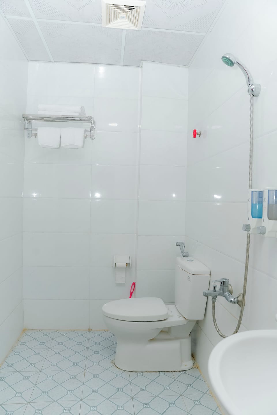 Shower, hair dryer, slippers, towels
