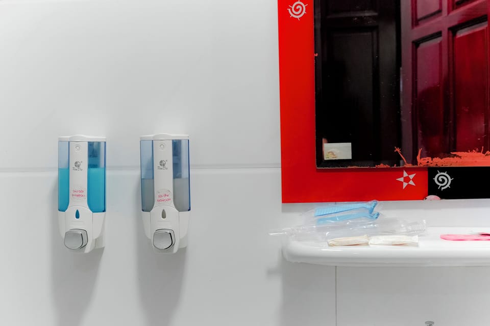 Shower, hair dryer, slippers, towels